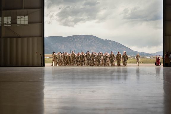 Service members arriving home during a military homecoming in Colorado Springs