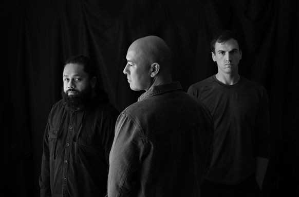 Black and white professional portraits of three men during a branding session