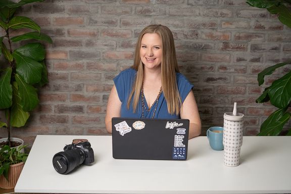 Female entrepreneur working on a laptop during a personal branding session