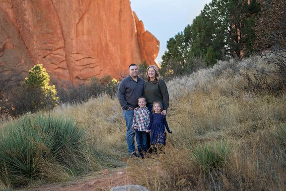Portrait of a mother photographed among the red rocks in Colorado Springs