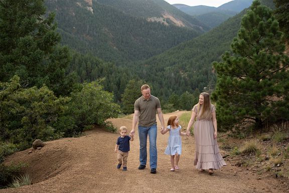 Family walking together in the Colorado mountains during an outdoor photography session