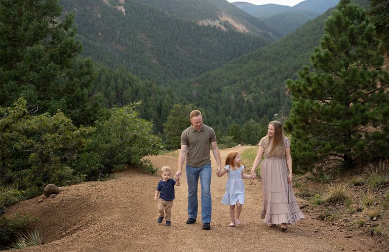 Family of five walking together in the Colorado mountains during an outdoor family photography session