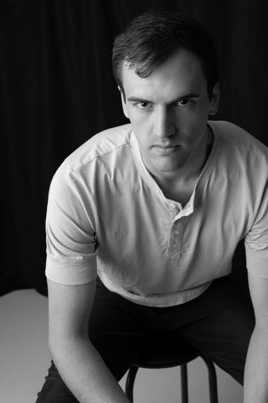 Black and white portrait of a man during a professional headshot session