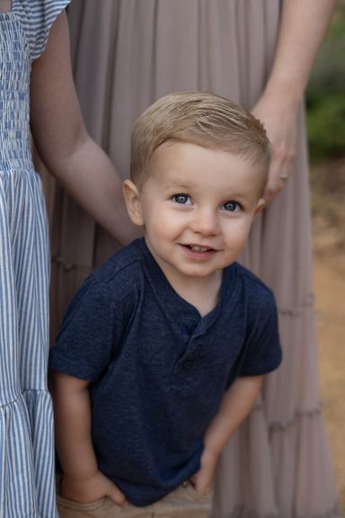 Young boy smiling during an outdoor family photography session