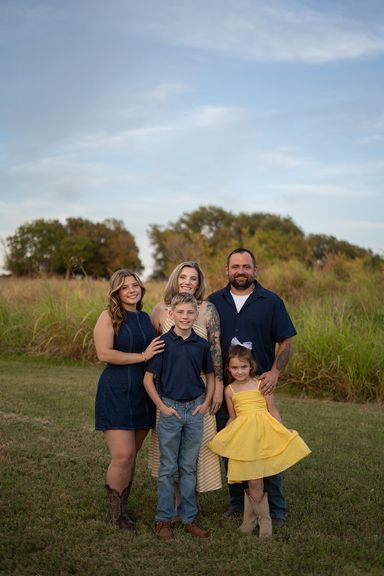 Family laughing together during a relaxed outdoor family photography session