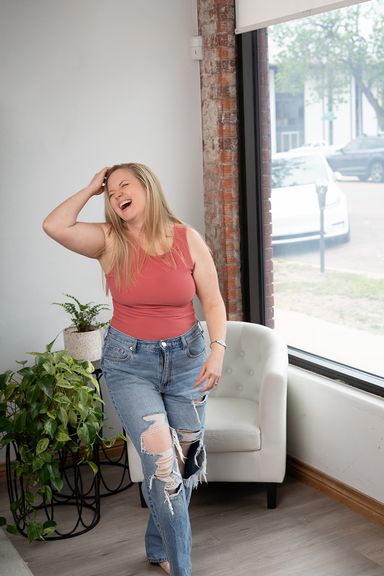 Woman laughing during a relaxed personal branding photography session