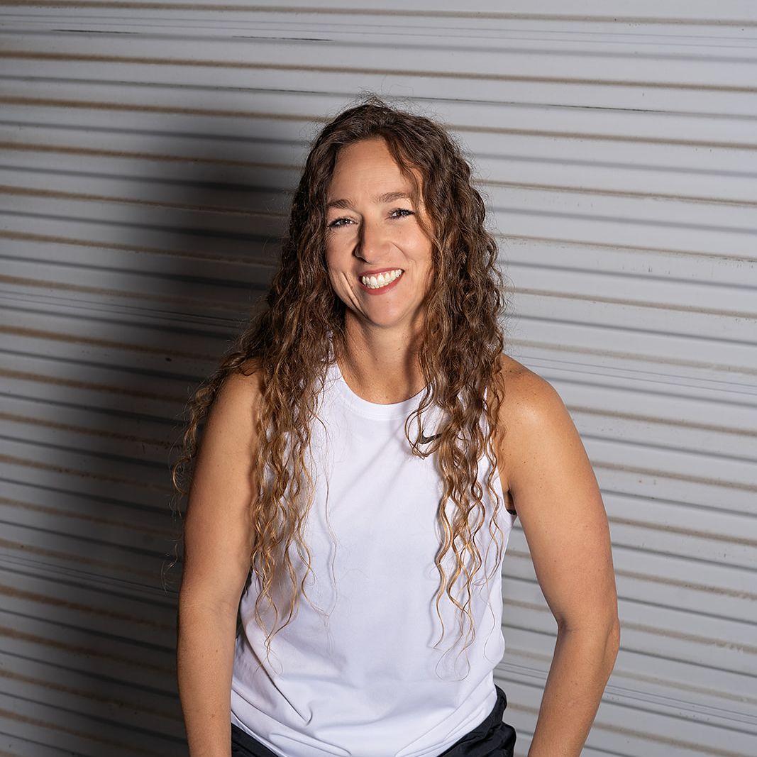 Business owner smiling during a relaxed personal branding photography session in Colorado Springs