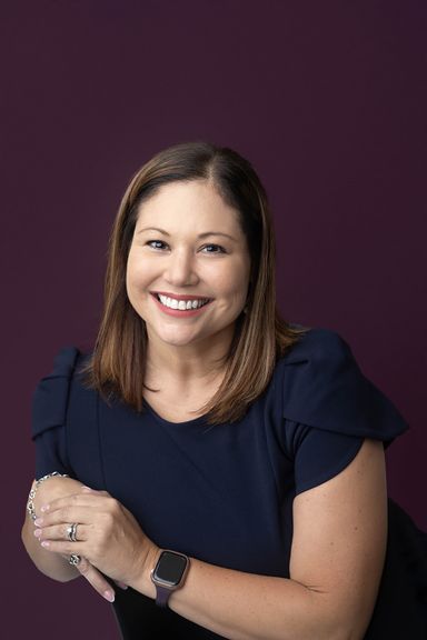 Professional headshot of a woman photographed in Colorado Springs