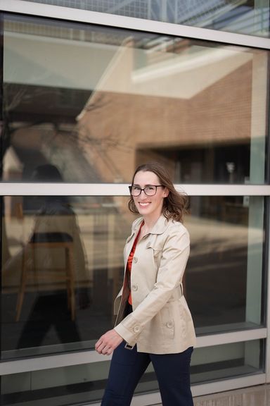 Female professional posing outdoors for a polished personal branding portrait