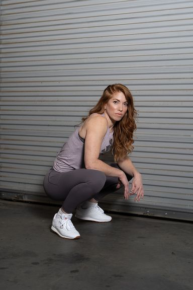 Female fitness professional posing outdoors for personal branding photography
